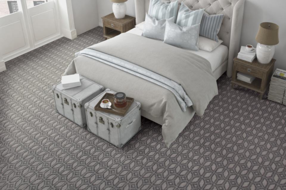 Grey mosaic patterned carpet in bedroom